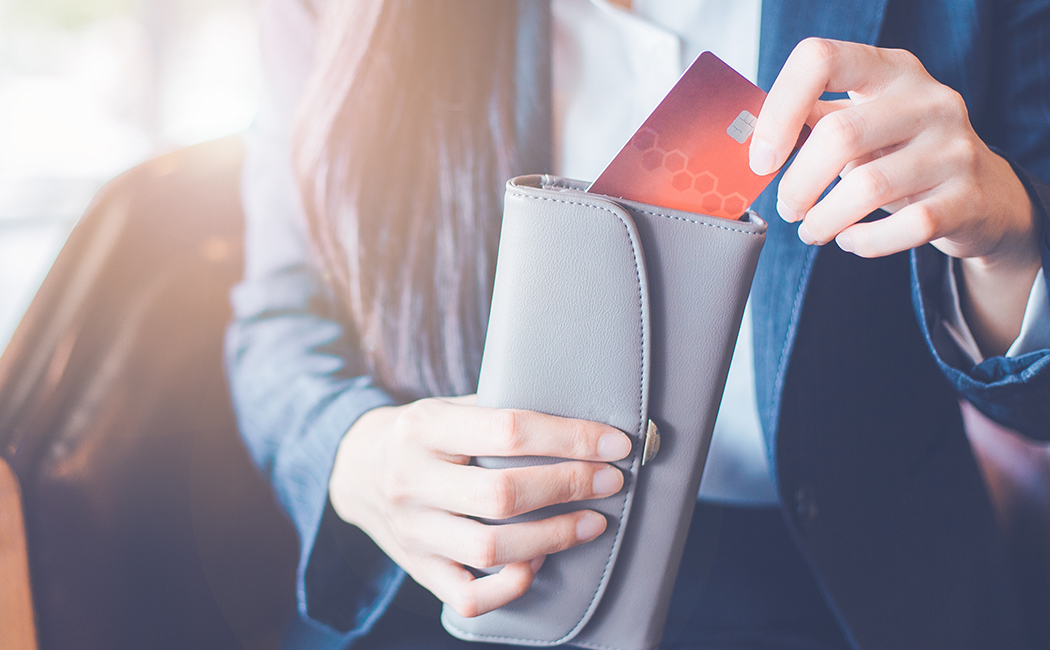 hands with credit card and wallet